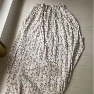 Custom fabric pinch pleat curtains with blackout lining.